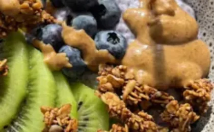 A close-up view of Blueberry Protein Chia Pudding layered with fresh blueberries.