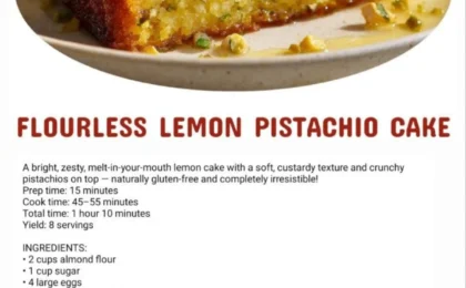 A golden flourless lemon pistachio cake on a rustic plate with pistachio garnish
