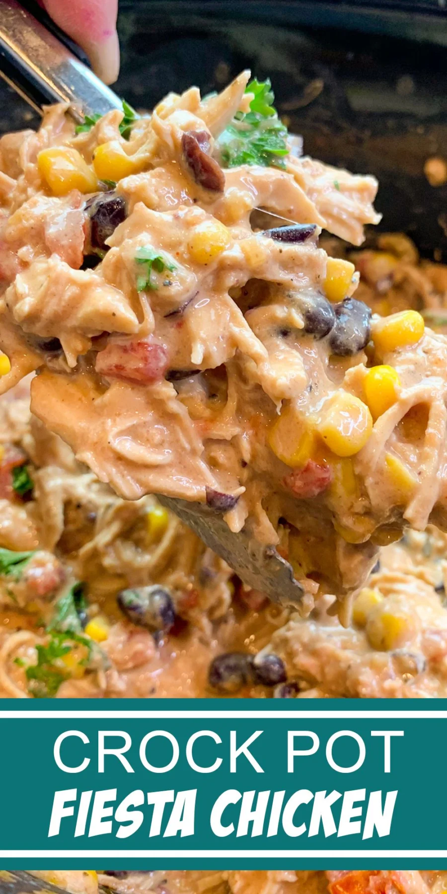 A spoon scoops creamy Crock Pot Fiesta Chicken with corn, black beans, and tomatoes, garnished with green onions and.
