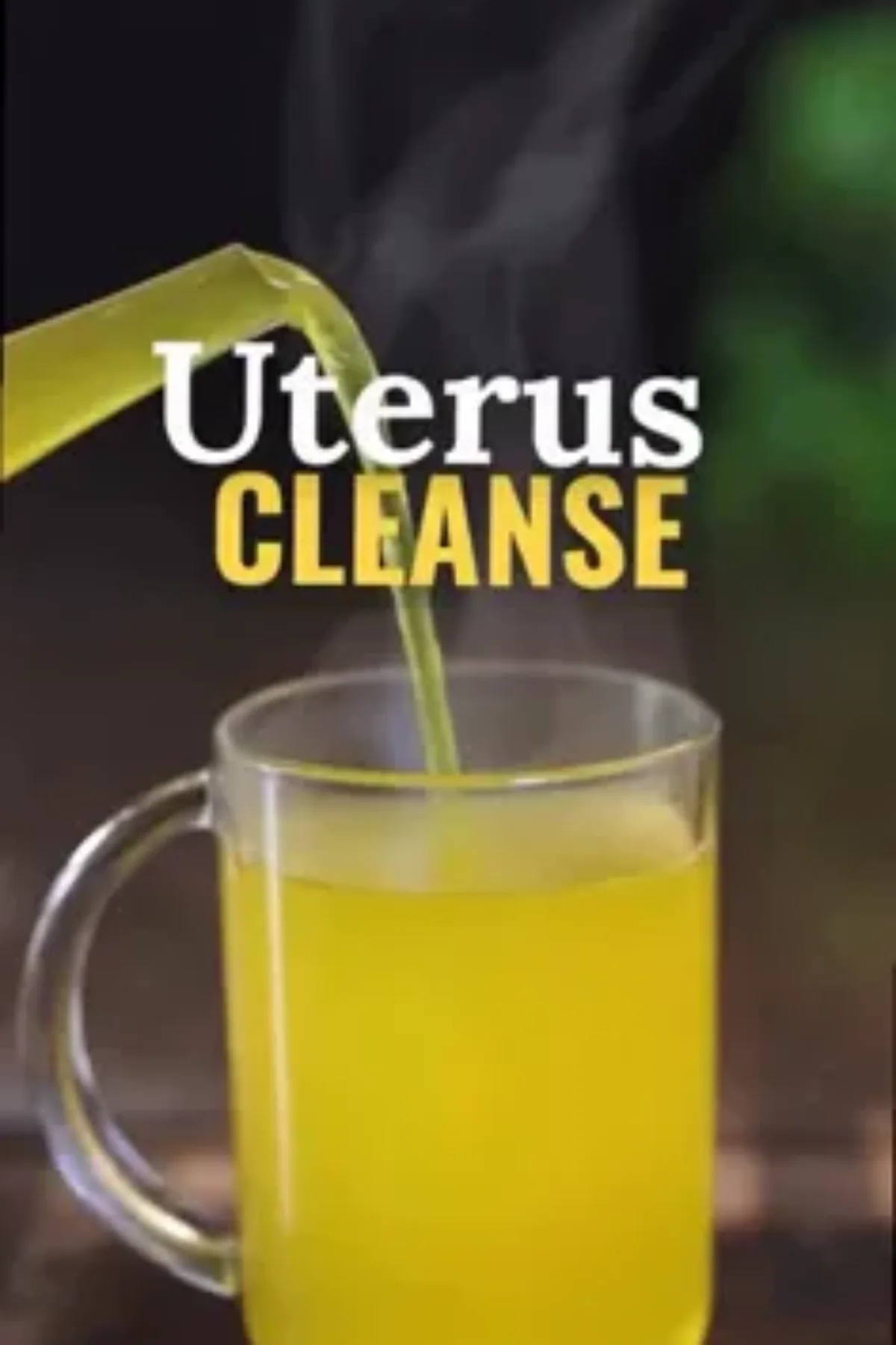 Steam rising from a glass mug of golden ginger lemon turmeric tea with fresh citrus slices and a cinnamon stick on a light.