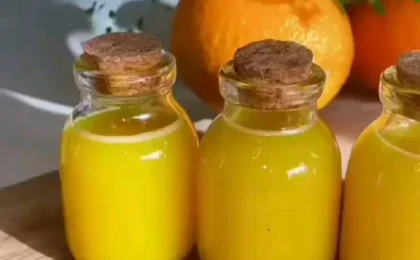 A vibrant collection of citrus wellness shots in small glasses, representing natural remedies for gut health.