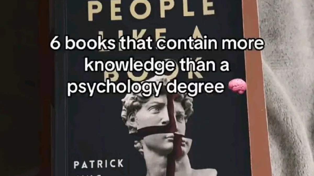 Stack of books on fabric featuring "Read People" by Patrick King with gold lettering