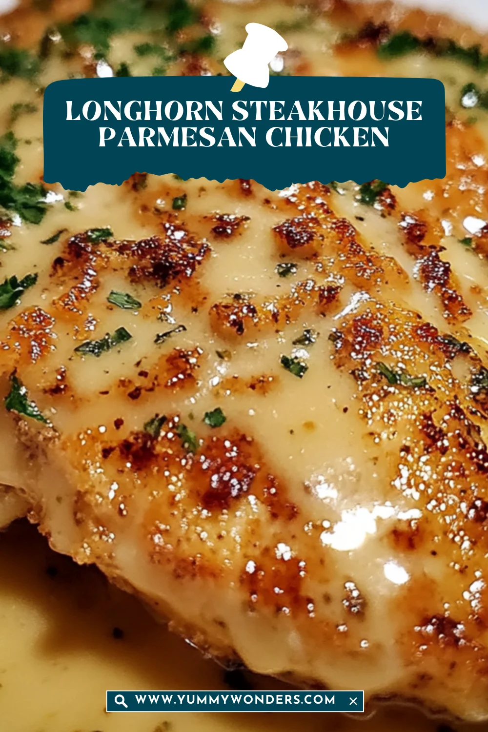 A thick, golden-brown chicken fillet covered in melted parmesan cheese and finely chopped green herbs on a white plate.