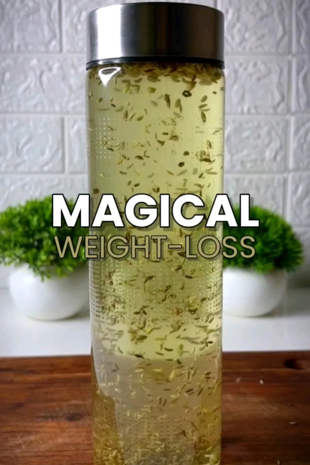 A glass of golden weight-loss drink with lemon slices, fresh mint, and ginger on a bright kitchen counter.
