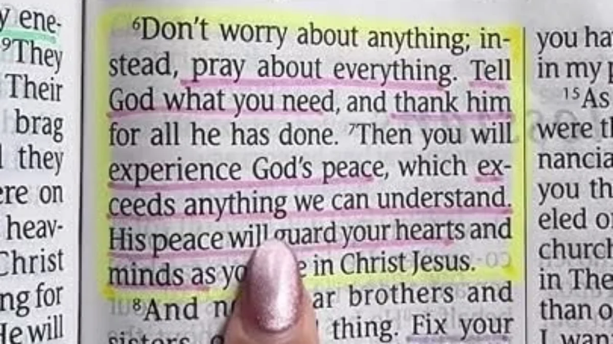 Hand pointing to highlighted Bible verse about not worrying and praying for peace