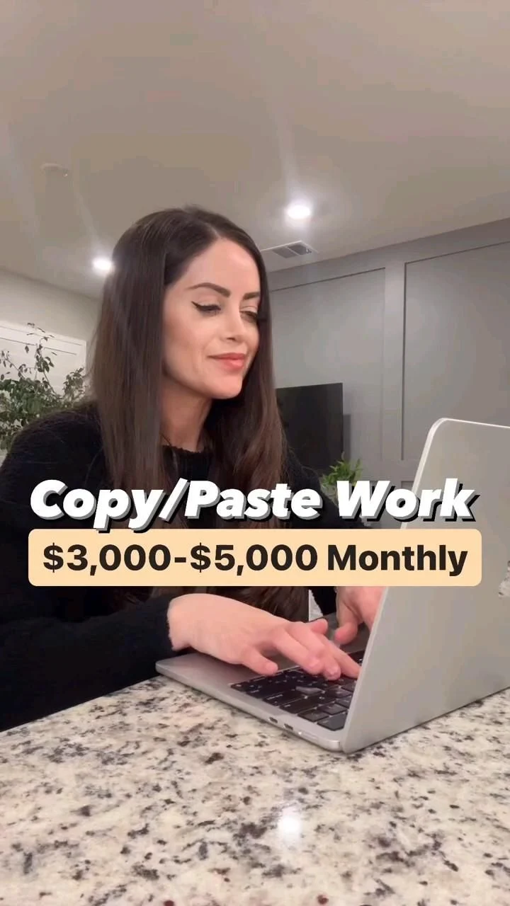 Person working on a laptop at a tidy home office desk with a notebook and coffee mug nearby